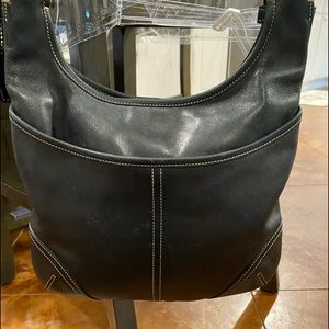 Coach handbag. Long handle. Cowhide leather. Used but still nice.